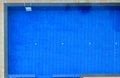 Top view of hotelÃ¢â¬â¢s blue tiled swimming pool background. Outdoor Sport, Recreation, Exercise, Family Activity, Leisure Royalty Free Stock Photo